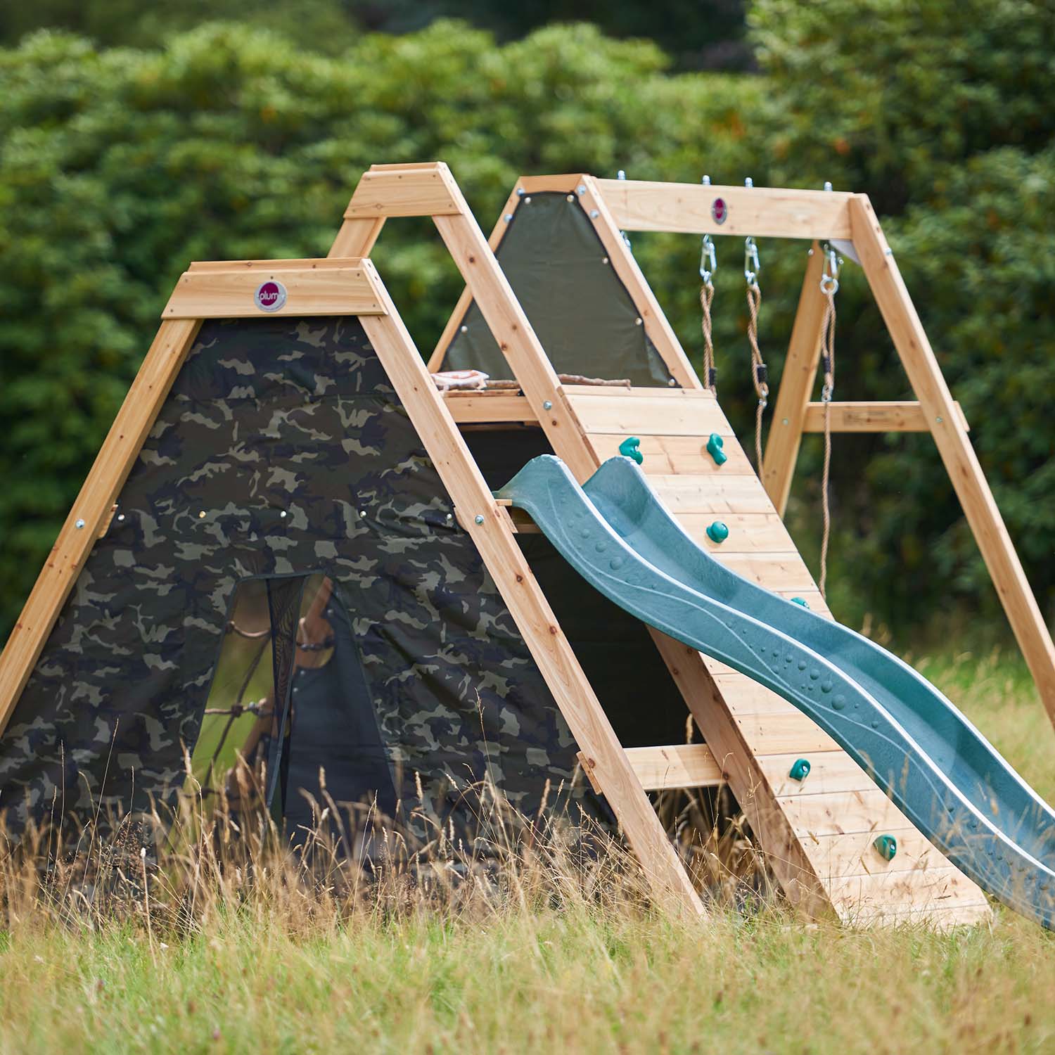 Ring angle view of Plum Play's Climbing Pyramid Wooden Climbing Frame with Swings installed in a lawn