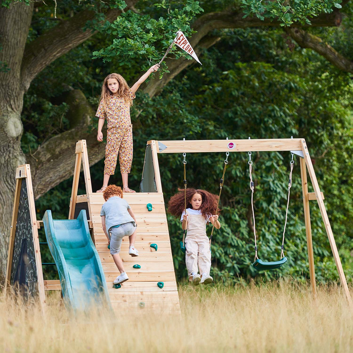 Children playing in Plum Play's Climbing Pyramid Wooden Climbing Frame with Swings