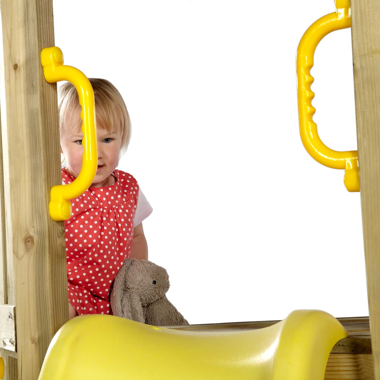 Yellow handles at the top of the slide in Plum Play's Toddlers Tower Wooden Climbing Frame for additional safety