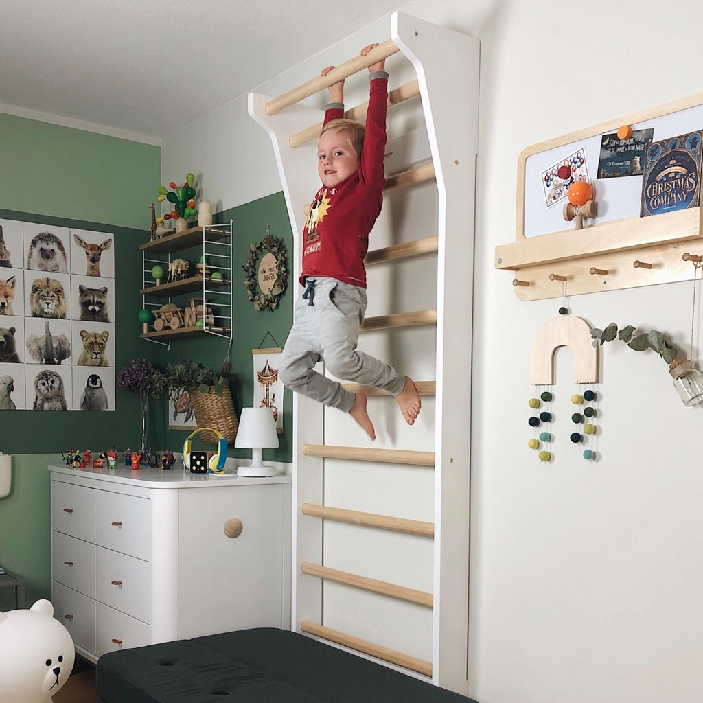 FitWood UPPLYFT Wall Bars with boy playing