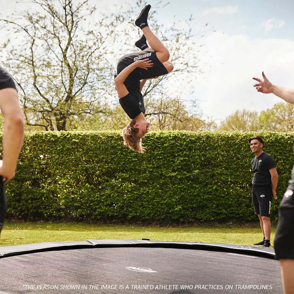 trained athletes practicing in BERG SPORTS Champion FlatGround Round Trampoline