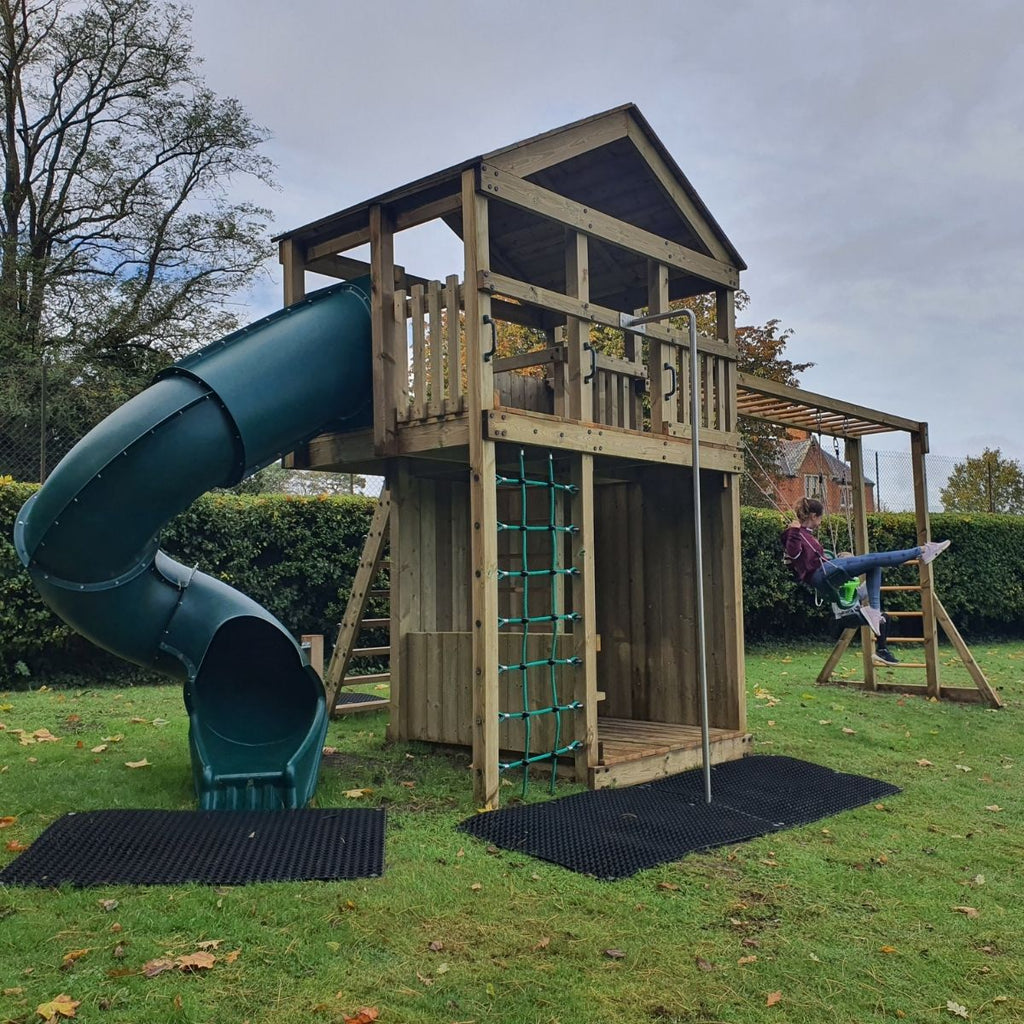Kids playing with swings on Discovery Timber Play Pioneer climbing frame