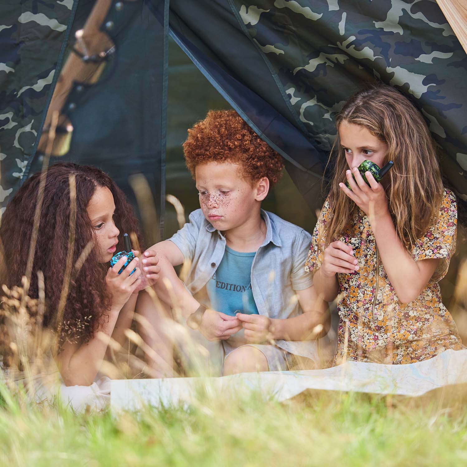 Children playing in the den area of Plum Play's Wooden Climbing Pyramid