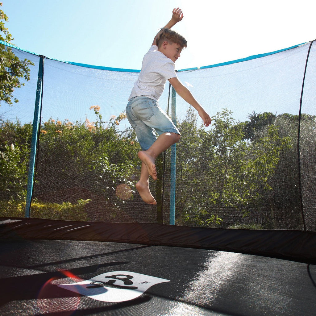 Boy jumping on TP Genius Trampoline