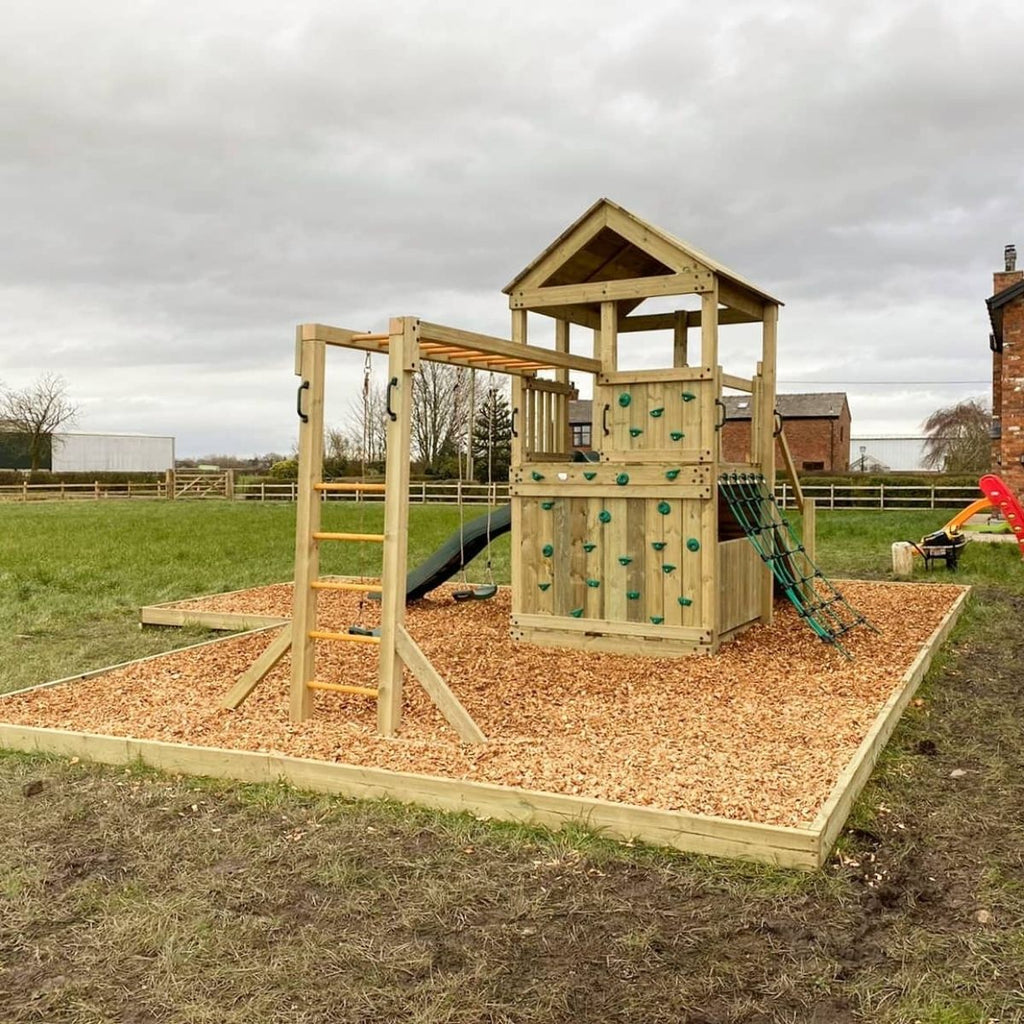 Discovery Timber Play Base Explorer Climbing Frame in garden with different configuration