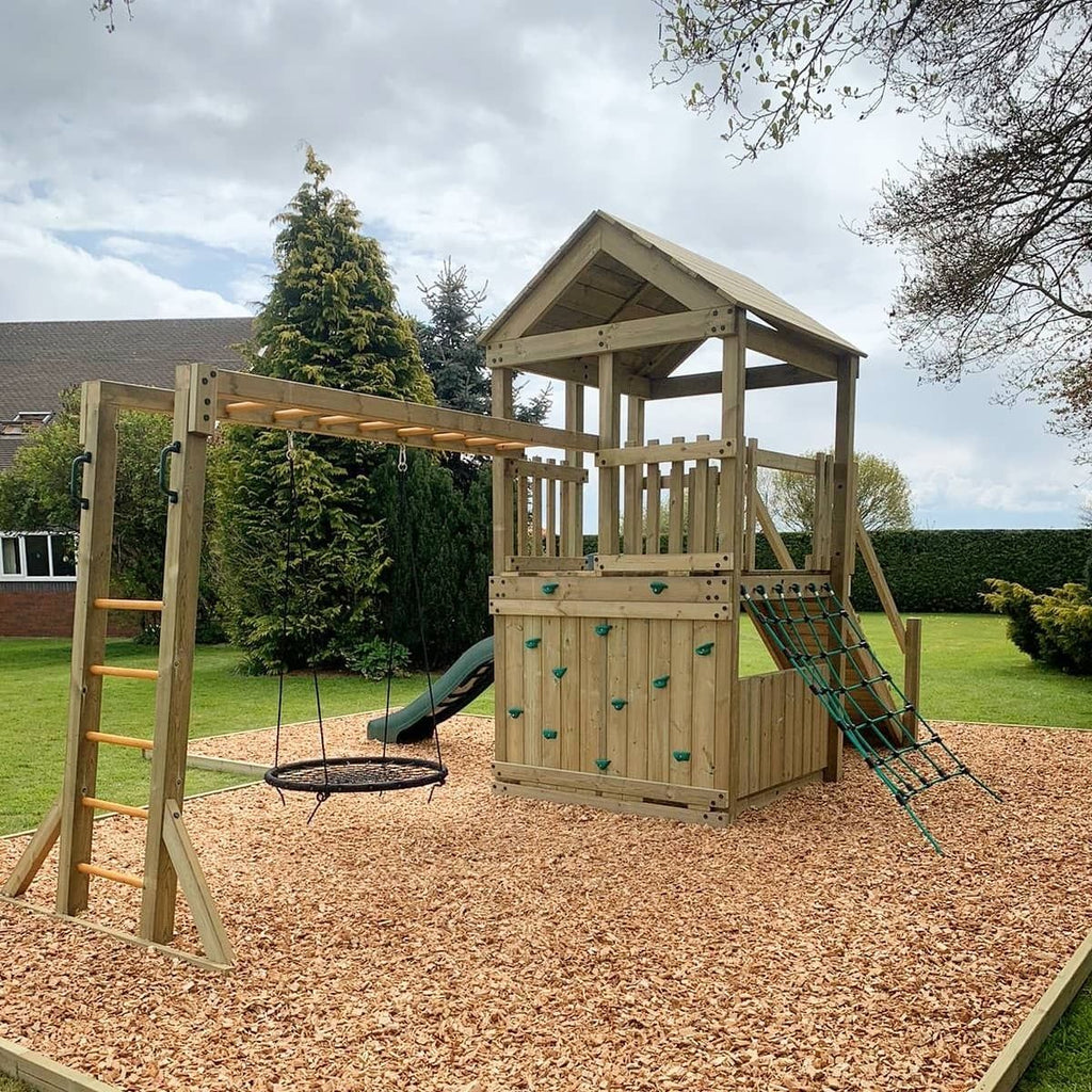 Discovery Timber Play Base Explorer Climbing Frame in garden with different configuration