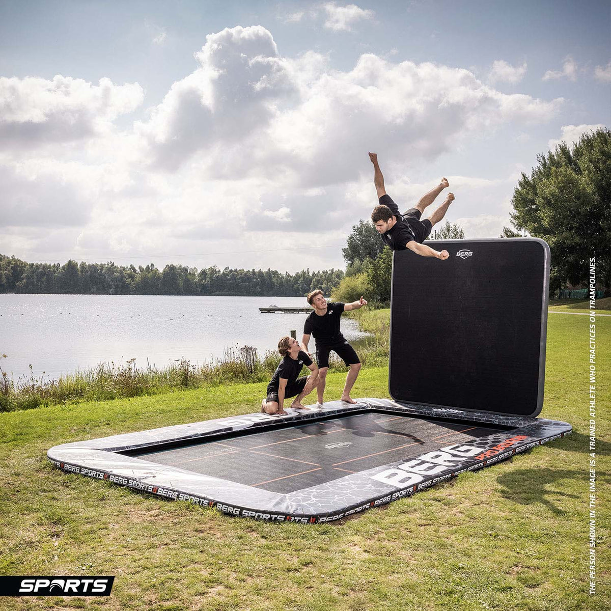 athletes having fun jumping on a BERG SPORTS Ultim Pro Bouncer FlatGround Rectangular Trampoline with AeroWall