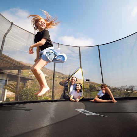 A child jumping on an Acon trampoline